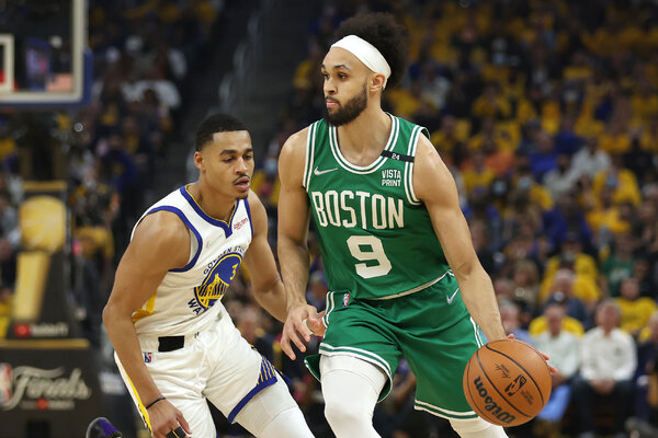 Golden State’s Jordan Poole, left, and Boston’s Derrick White during the first half of Game 1.